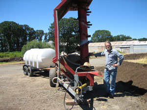 Smith beside compost turner